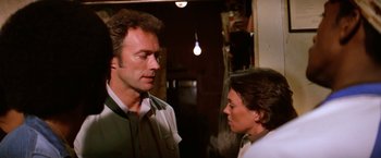 Movie still from “The Enforcer” (1976), directed by James Fargo – A man and a woman talking to each other; Close Up shot, Over the shoulder angle