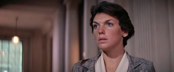 Movie still from “The Enforcer” (1976), directed by James Fargo – A person with short hair wearing a jacket; Close Up shot, Low angle