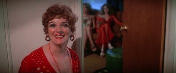 Movie still from “The Enforcer” (1976), directed by James Fargo – A person in a room with other people; Close Up shot, Over the shoulder angle