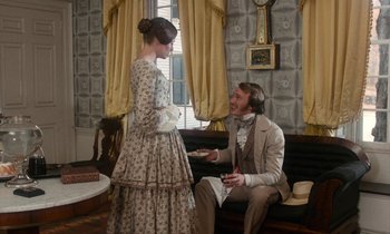Movie still from “The Europeans” (1979), directed by James Ivory – A man and a woman dressed in period clothing; Medium shot, Over the shoulder angle