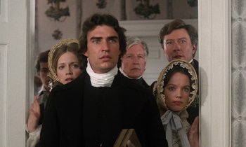 Movie still from “The Europeans” (1979), directed by James Ivory – A group of people standing next to each other; Medium shot, Low angle