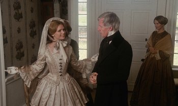 Movie still from “The Europeans” (1979), directed by James Ivory – An older man and woman dressed in period clothing; Medium shot, Over the shoulder angle