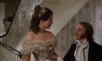 Movie still from “The Europeans” (1979), directed by James Ivory – A man and a woman dressed in period clothing; Medium shot, Low angle