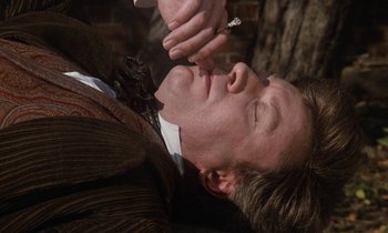 Movie still from “The Europeans” (1979), directed by James Ivory – A man is laying down with his eyes closed; Close Up shot, Overhead angle