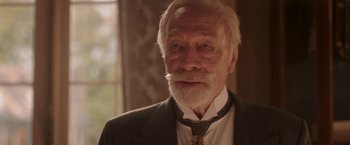 Movie still from “The Exception” (2016), directed by David Leveaux – An older man with a beard and a mustache; Close Up shot, Low angle