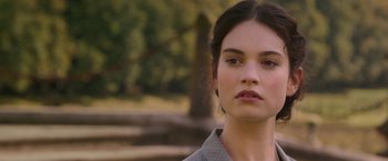 Movie still from “The Exception” (2016), directed by David Leveaux – A person wearing a dress shirt; Close Up shot, Over the shoulder angle