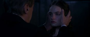 Movie still from “The Exception” (2016), directed by David Leveaux – A man and a woman are looking at each other in the dark; Close Up shot, Over the shoulder angle