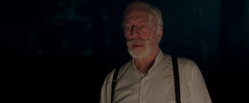 Movie still from “The Exception” (2016), directed by David Leveaux – An older man with a beard and a white shirt; Close Up shot, Low angle