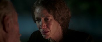 Movie still from “The Exception” (2016), directed by David Leveaux – A woman's face in the dark; Close Up shot, Over the shoulder angle