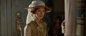 Movie still from “The Extraordinary Adventures of Adèle Blanc-Sec” (2010), directed by Luc Besson – A woman wearing a white hat and a vest; Close Up shot, Over the shoulder angle