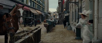 Movie still from “The Extraordinary Adventures of Adèle Blanc-Sec” (2010), directed by Luc Besson – An empty street in the middle of a city; Extreme Wide shot, High angle