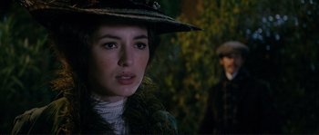 Movie still from “The Extraordinary Adventures of Adèle Blanc-Sec” (2010), directed by Luc Besson – A person wearing a hat; Close Up shot, Over the shoulder angle