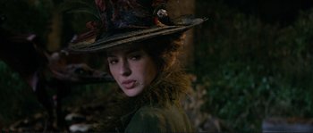 Movie still from “The Extraordinary Adventures of Adèle Blanc-Sec” (2010), directed by Luc Besson – A woman in a hat and a green jacket; Close Up shot, Over the shoulder angle