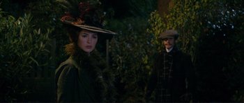 Movie still from “The Extraordinary Adventures of Adèle Blanc-Sec” (2010), directed by Luc Besson – A man and a woman dressed in victorian clothing; Medium shot, Over the shoulder angle