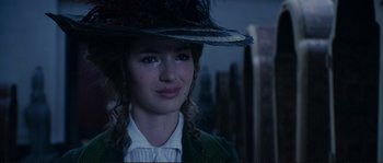 Movie still from “The Extraordinary Adventures of Adèle Blanc-Sec” (2010), directed by Luc Besson – A young woman wearing a hat and a green jacket; Close Up shot, Over the shoulder angle