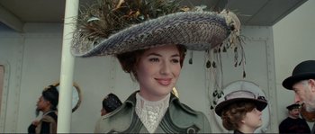 Movie still from “The Extraordinary Adventures of Adèle Blanc-Sec” (2010), directed by Luc Besson – A woman wearing a hat and a green coat; Close Up shot, Low angle