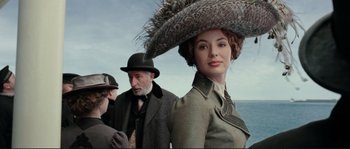 Movie still from “The Extraordinary Adventures of Adèle Blanc-Sec” (2010), directed by Luc Besson – An old man and a young woman wearing a hat; Close Up shot, Low angle