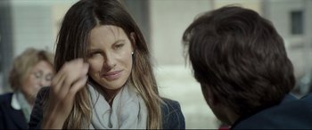 Movie still from “The Face of an Angel” (2014), directed by Michael Winterbottom – A beautiful woman wearing a white scarf and a black jacket; Close Up shot, Over the shoulder angle