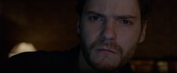 Movie still from “The Face of an Angel” (2014), directed by Michael Winterbottom – A person with a beard; Close Up shot, Over the shoulder angle