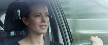 Movie still from “The Face of an Angel” (2014), directed by Michael Winterbottom – A woman sitting in the passenger seat of a car; Close Up shot, Over the shoulder angle