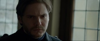 Movie still from “The Face of an Angel” (2014), directed by Michael Winterbottom – A person with a beard; Close Up shot, Over the shoulder angle