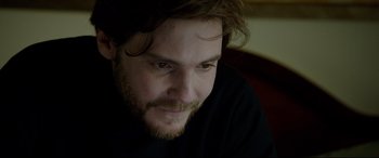 Movie still from “The Face of an Angel” (2014), directed by Michael Winterbottom – A person wearing a black shirt; Close Up shot, Over the shoulder angle