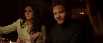 Movie still from “The Face of an Angel” (2014), directed by Michael Winterbottom – A man and a woman sitting at a dinner table; Close Up shot, Over the shoulder angle