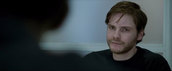 Movie still from “The Face of an Angel” (2014), directed by Michael Winterbottom – A person sitting in front of a mirror; Close Up shot, Over the shoulder angle