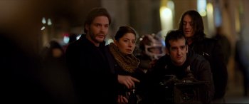 Movie still from “The Face of an Angel” (2014), directed by Michael Winterbottom – A man and a woman standing next to each other; Medium shot, Over the shoulder angle