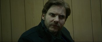 Movie still from “The Face of an Angel” (2014), directed by Michael Winterbottom – A person wearing a jacket; Close Up shot, Over the shoulder angle