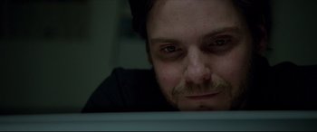 Movie still from “The Face of an Angel” (2014), directed by Michael Winterbottom – A person looking at a computer screen; Close Up shot, Low angle