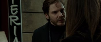Movie still from “The Face of an Angel” (2014), directed by Michael Winterbottom – A person with a beard; Close Up shot, Over the shoulder angle