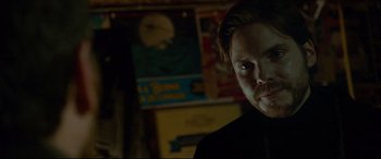 Movie still from “The Face of an Angel” (2014), directed by Michael Winterbottom – A person wearing a black shirt; Close Up shot, Over the shoulder angle