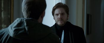 Movie still from “The Face of an Angel” (2014), directed by Michael Winterbottom – A man looking at himself in the mirror; Close Up shot, Over the shoulder angle