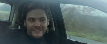 Movie still from “The Face of an Angel” (2014), directed by Michael Winterbottom – A person sitting in a car; Close Up shot, Over the shoulder angle