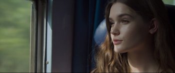 Movie still from “The Face of an Angel” (2014), directed by Michael Winterbottom – A person with long hair; Close Up shot, Low angle