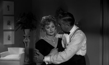 Movie still from “The Facts of Life” (1960), directed by Melvin Frank – A man and a woman are dancing in a room; Medium shot, Over the shoulder angle