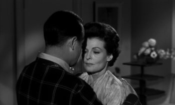 Movie still from “The Facts of Life” (1960), directed by Melvin Frank – An older man and a younger woman embracing each other; Close Up shot, Low angle