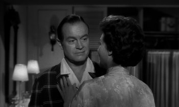 Movie still from “The Facts of Life” (1960), directed by Melvin Frank – An older man and a younger woman are looking at each other; Close Up shot, Over the shoulder angle