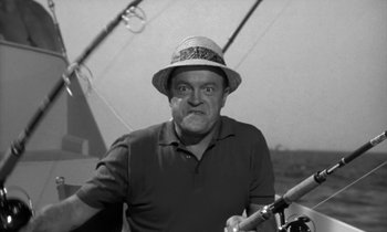 Movie still from “The Facts of Life” (1960), directed by Melvin Frank – An older man wearing a straw hat while holding a fishing rod; Medium shot, Low angle