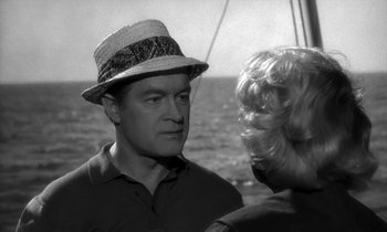 Movie still from “The Facts of Life” (1960), directed by Melvin Frank – A black and white photo of a man and a woman on a boat; Close Up shot, Over the shoulder angle