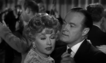 Movie still from “The Facts of Life” (1960), directed by Melvin Frank – An old photo of a man and a woman dancing; Close Up shot, Over the shoulder angle