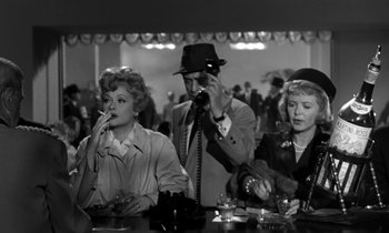 Movie still from “The Facts of Life” (1960), directed by Melvin Frank – A group of people sitting at a table with drinks; Medium shot, High angle