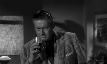 Movie still from “The Facts of Life” (1960), directed by Melvin Frank – A black and white photo of a man drinking a glass of wine; Close Up shot, Low angle