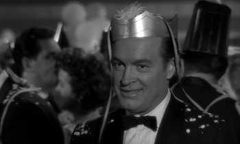 Movie still from “The Facts of Life” (1960), directed by Melvin Frank – A black and white photo of a man wearing a hat; Close Up shot, Low angle