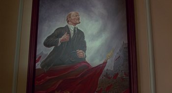 Movie still from “The Falcon and the Snowman” (1985), directed by John Schlesinger – A painting of a man in a black suit; Medium shot, Low angle