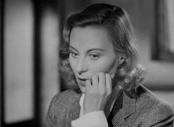Movie still from “The Fallen Idol” (1948), directed by Carol Reed – A black - and - white photo of a woman in a suit; Close Up shot, High angle
