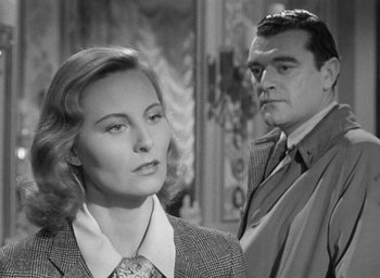 Movie still from “The Fallen Idol” (1948), directed by Carol Reed – A man and a woman standing next to each other; Close Up shot, Over the shoulder angle