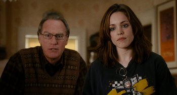 Movie still from “The Family Stone” (2005), directed by Thomas Bezucha – A man and a woman standing next to each other in a room; Close Up shot, Over the shoulder angle