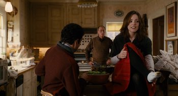 Movie still from “The Family Stone” (2005), directed by Thomas Bezucha – A group of people standing around a table; Medium shot, Over the shoulder angle